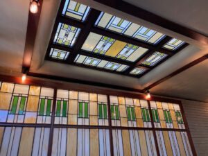 Art glass window and skyline in the old City National Bank building in the Frank Lloyd Wright-designed Historic Park Inn Hotel in Mason City, Iowa
