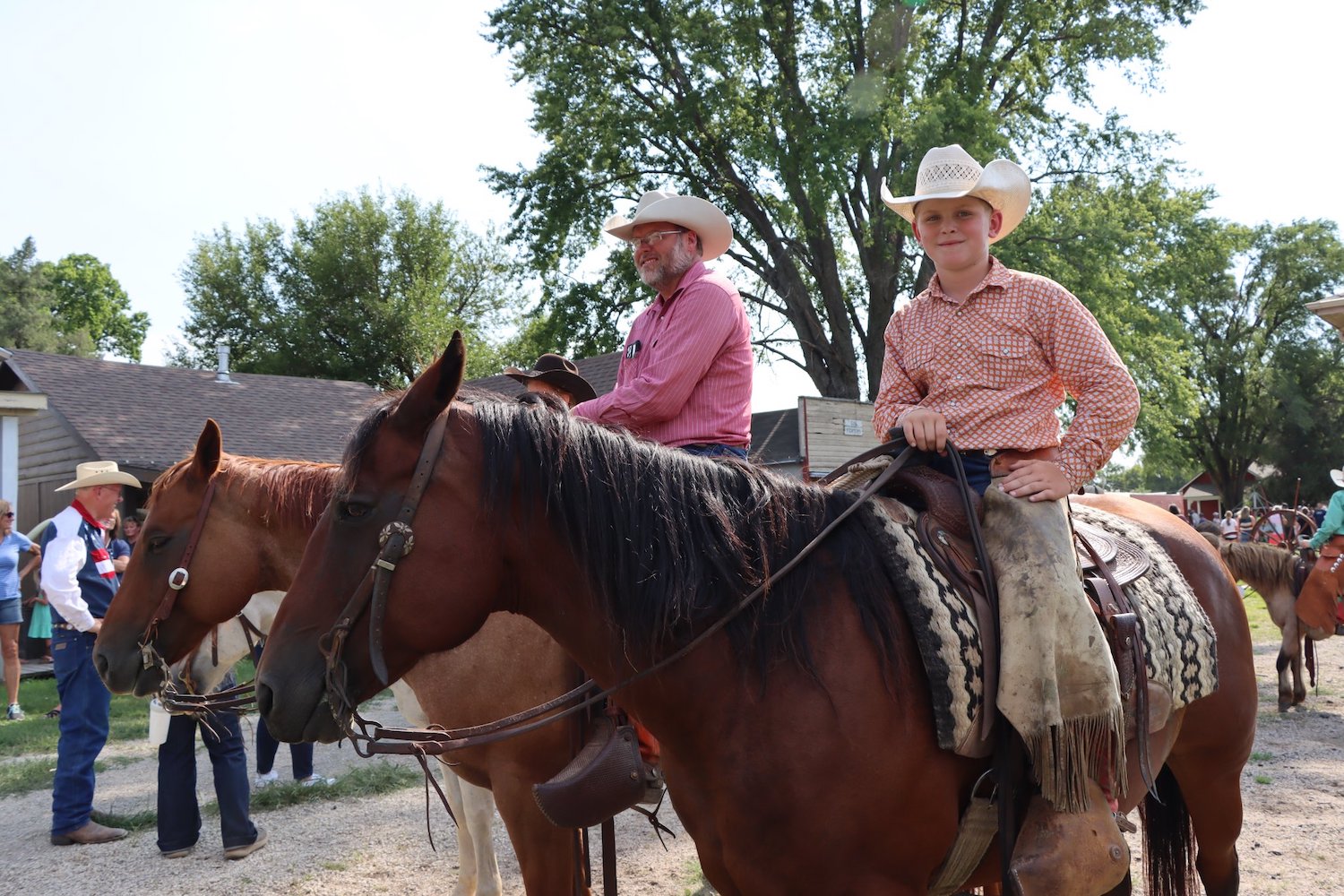 Volunteers on horseback during cattle drive at Old Abilene Town in Abilene, Kansas