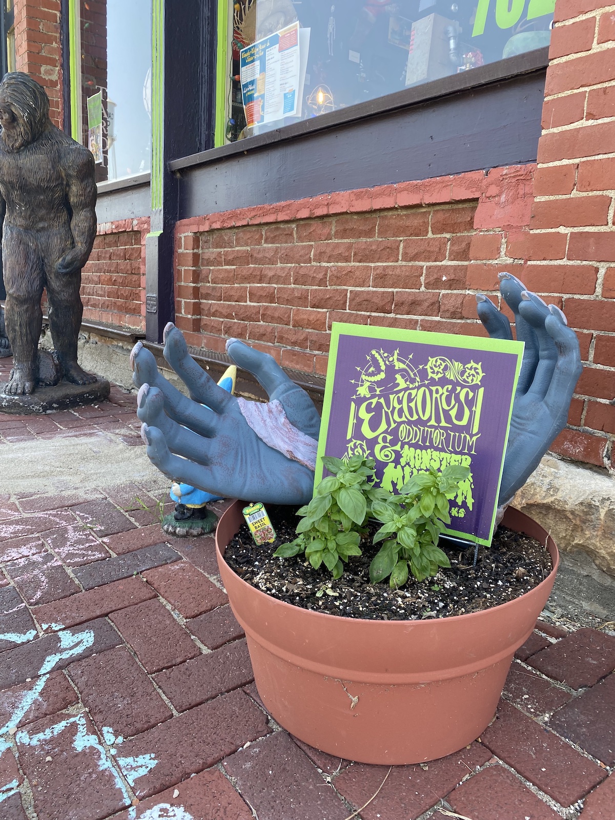 Monster hands holding sign at Eyegore's Odditorium and Monster Museum in Cawker City, Kansas