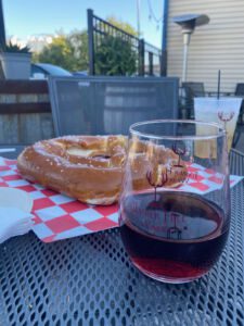 Glass of wine and giant soft pretzel at Timber Hill Winery in Milton, Wisconsin