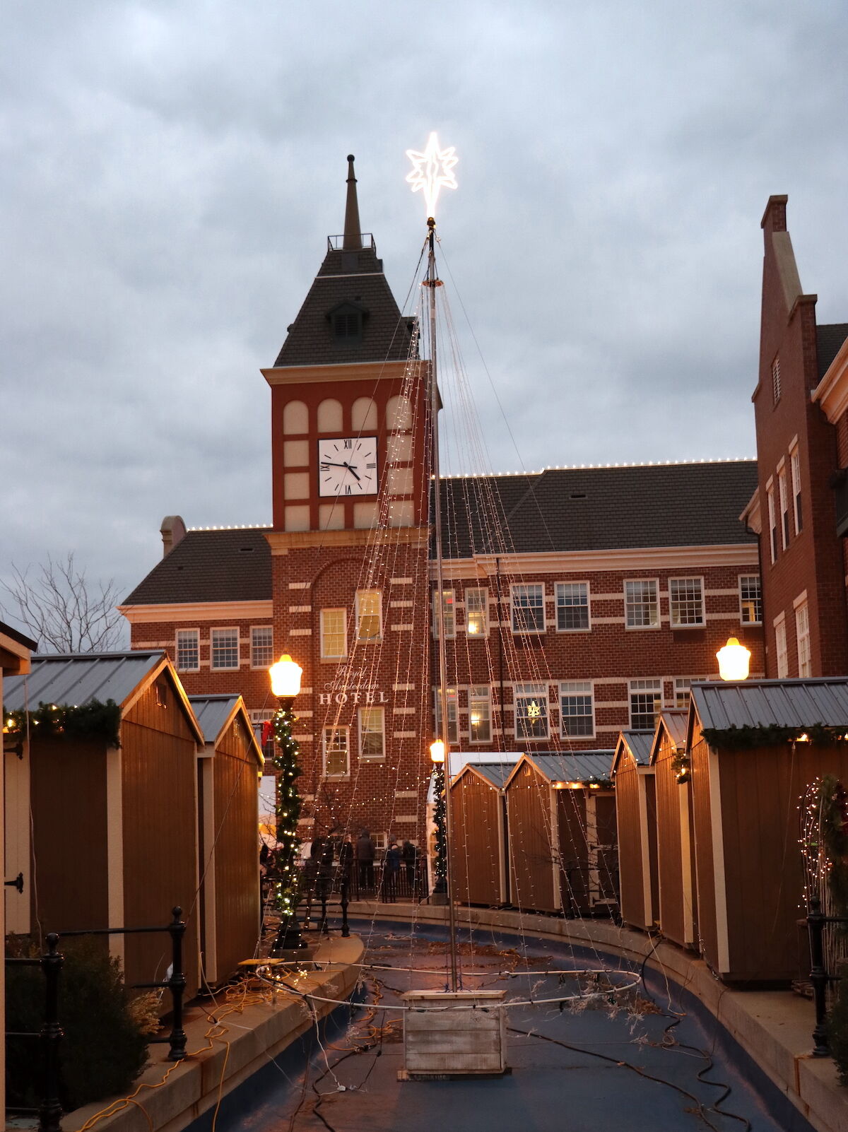 Stalls and holiday lights at Kerstmarkt, Pella's Dutch Christmas market in Pella, Iowa