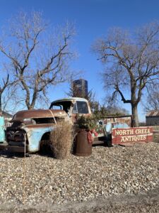 Rusted pick-up truck outside of North Creek Antiques in Pella, Iowa