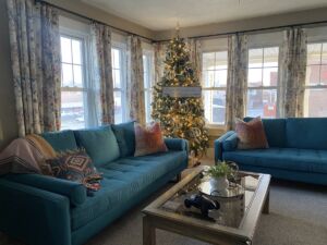 Living room with Christmas tree at Airbnb in Oskaloosa, Iowa