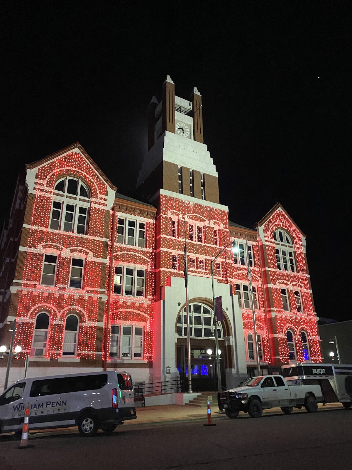Lighted buildings around City Square Park in Oskaloosa, Iowa