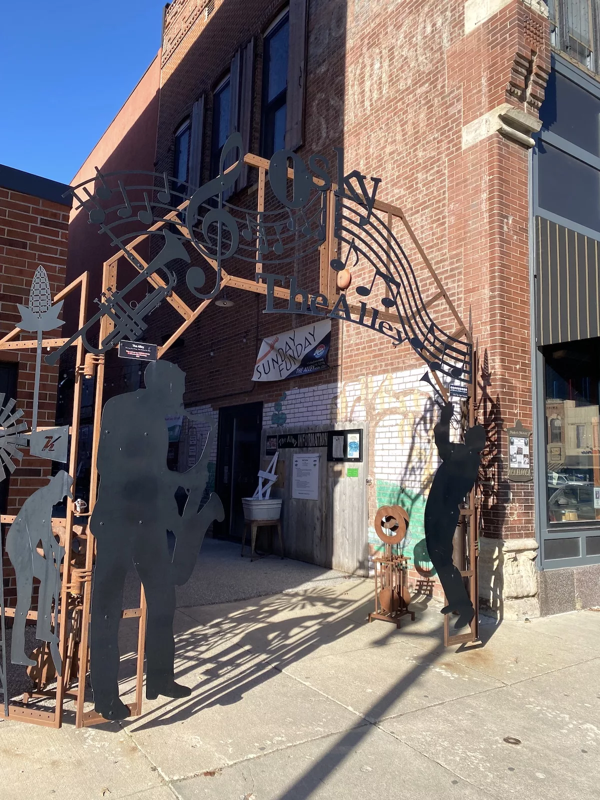 Metal signage for The Alley in Oskaloosa, Iowa