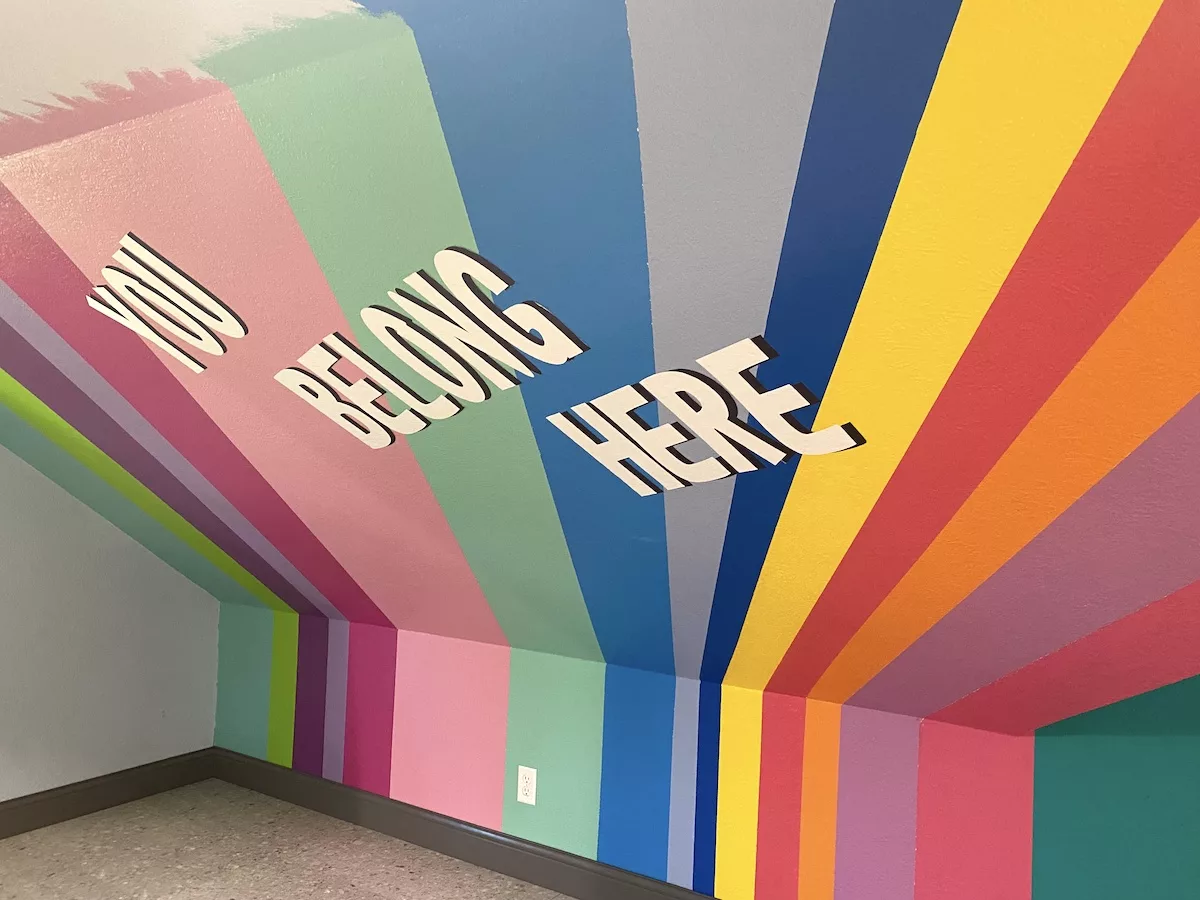 Rainbow mural that says "You Belong Here" at Baker Arts Center in Liberal, Kansas