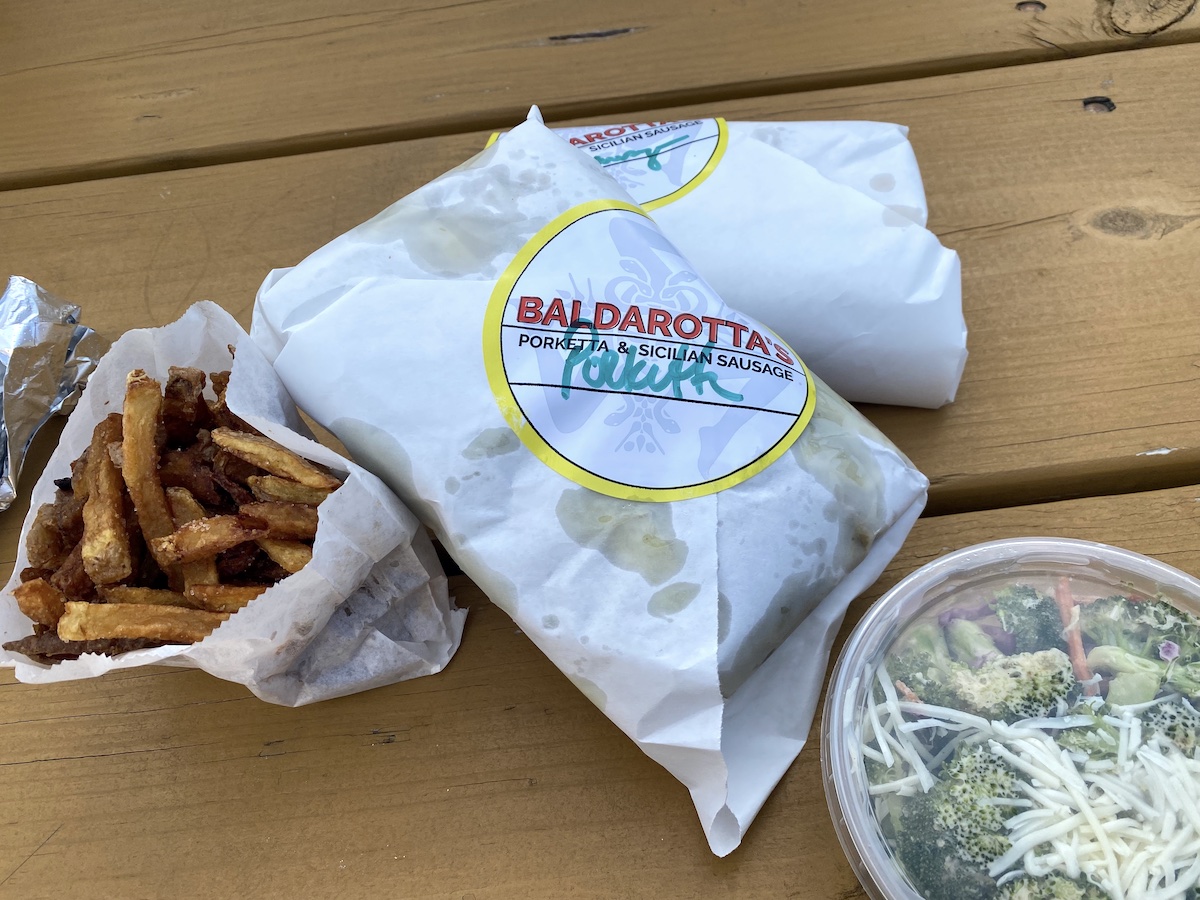 Sandwiches, French fries and broccoli salad from Baldarotta’s Porketta & Sicilian Sandwiches in Urbana, Illinois