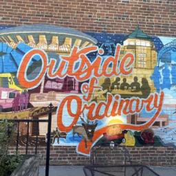 Mural that says "Outside of Ordinary" in downtown Champaign, Illinois