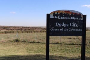 Sign that says "Dodge City: Queen of the Cowtowns" at the Cattle & Feedlot Overlook in Dodge City, Kansas