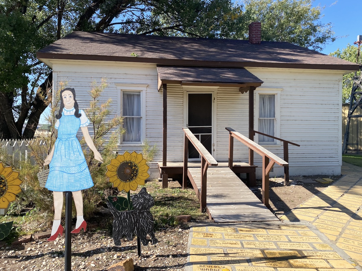 Exterior of white cottage known as Dorothy's House at Dorothy's House & Land of Oz in Liberal, Kansas