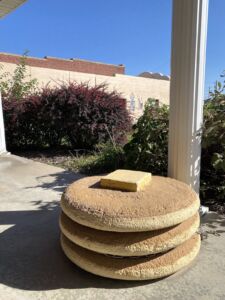 Statue of a stack of pancakes outside of the International Pancake Day Hall of Fame in Liberal, Kansas