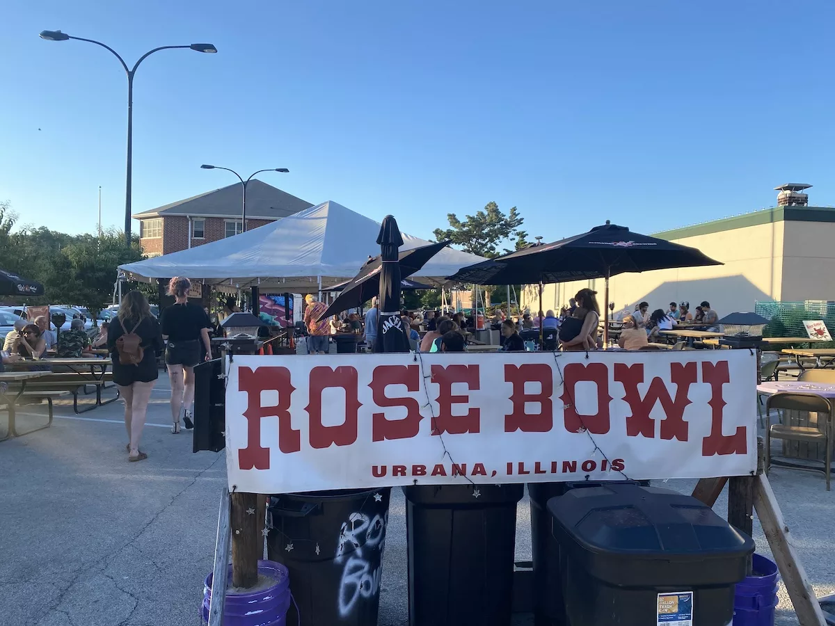 Signage and outdoor seating at the Rose Bowl Tavern in Urbana, Illinois