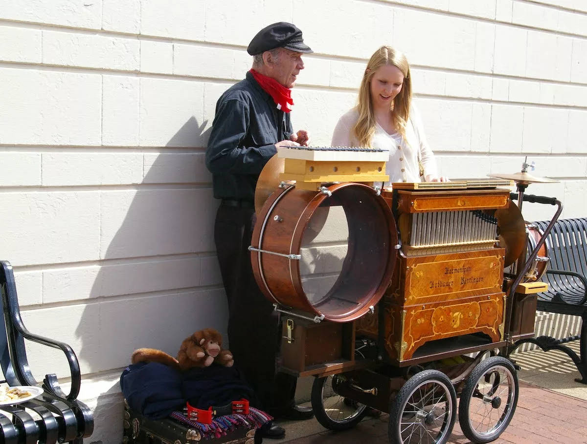 Man with musical band instrument next to woman during Tulip Time in Pella, Iowa