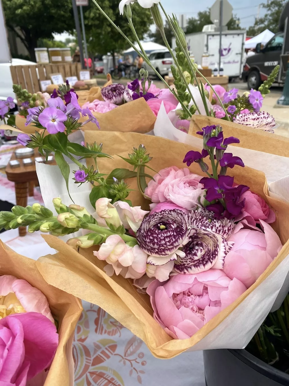 Bouquets of pink and purple flowers at Cedar Falls Farmers' Market in Cedar Falls, Iowa