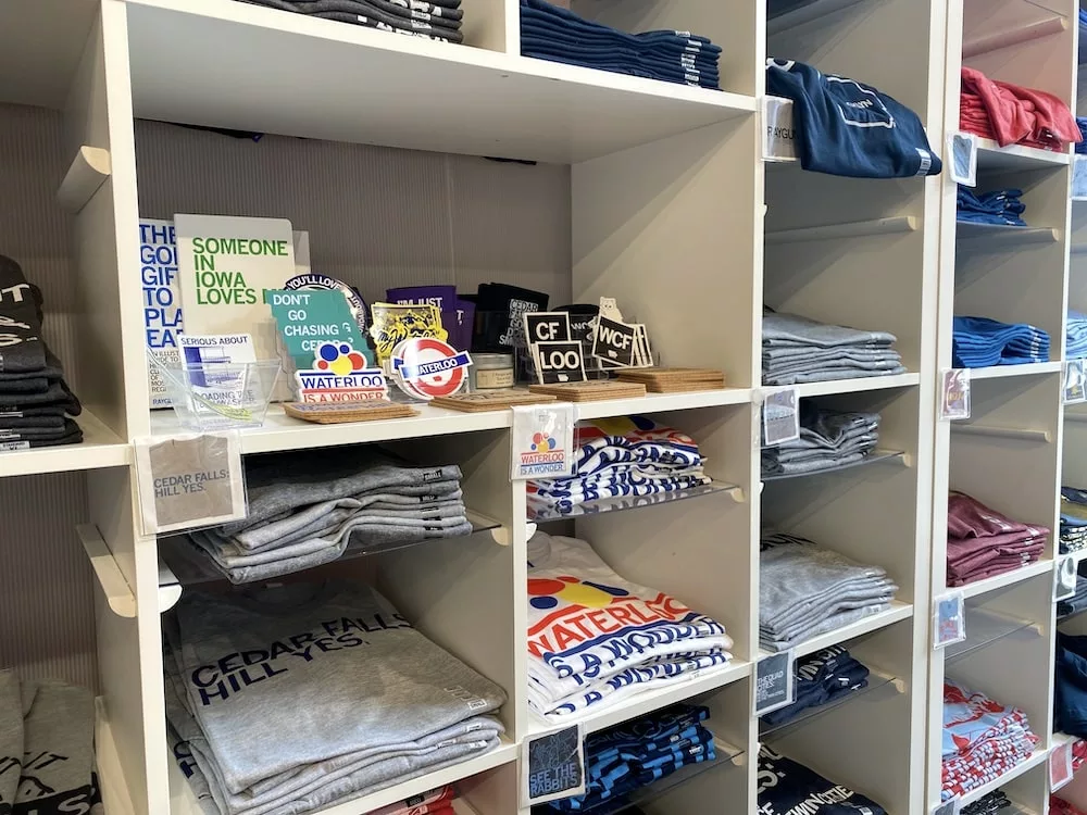 Shelf of T-shirts about Cedar Falls at RAYGUN in Cedar Falls, Iowa