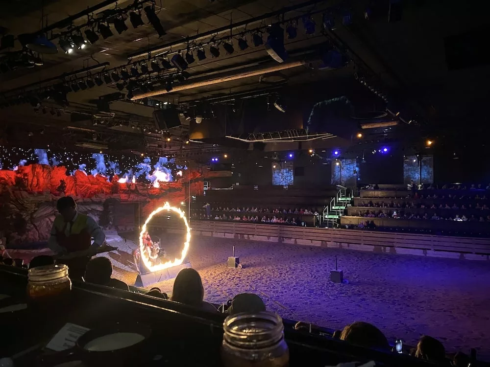 Horse jumping through ring of fire at Dolly's Stampede in Branson, Missouri